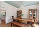 Spacious dining room with stylish wood table, storage, and decorative lighting at 2290 Deer Sight Way, Mount Pleasant, SC 29466