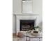 Classic fireplace with a decorative mantel and a mirror above a glass coffee table at 2290 Deer Sight Way, Mount Pleasant, SC 29466