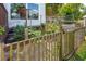 A beautiful backyard garden with a charming wooden fence and lush plants at 2290 Deer Sight Way, Mount Pleasant, SC 29466