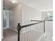 Carpeted hallway with classic black and white bannister detail at 2290 Deer Sight Way, Mount Pleasant, SC 29466