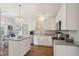 Well-lit kitchen features white cabinets, stainless appliances, and a functional island at 2290 Deer Sight Way, Mount Pleasant, SC 29466