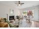 Cozy living room with fireplace, comfortable seating, a ceiling fan and natural light at 2290 Deer Sight Way, Mount Pleasant, SC 29466