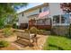 Well-maintained backyard patio with bench seating, landscaping, and American Flag at 2290 Deer Sight Way, Mount Pleasant, SC 29466