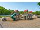 Vibrant playground with climbing structures, slides, and tennis courts in the background at 2290 Deer Sight Way, Mount Pleasant, SC 29466