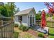 Well-maintained shed with a gray exterior, shuttered window box, and a small deck at 2290 Deer Sight Way, Mount Pleasant, SC 29466