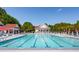 Large swimming pool with multiple lap lanes and lounge chairs with umbrellas at 2290 Deer Sight Way, Mount Pleasant, SC 29466