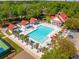 Aerial view of a large community swimming pool with palm trees and lounge chairs at 2290 Deer Sight Way, Mount Pleasant, SC 29466