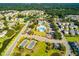 This aerial showcases the community's layout, pool, tennis courts, and picturesque homes surrounded by lush greenery at 2292 Skyler Dr, Mount Pleasant, SC 29466
