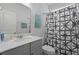 Well-lit bathroom featuring a gray vanity and a shower-tub combination at 2292 Skyler Dr, Mount Pleasant, SC 29466