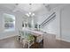 Elegant dining room featuring coffered ceiling, hardwood floors, and ample natural light at 2292 Skyler Dr, Mount Pleasant, SC 29466