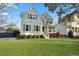 Charming two-story home with a well-manicured lawn, lush landscaping, and welcoming front porch at 2292 Skyler Dr, Mount Pleasant, SC 29466