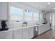 A well-equipped kitchen with white cabinets, granite countertops, and stainless steel appliances at 2292 Skyler Dr, Mount Pleasant, SC 29466