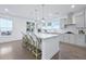 Bright kitchen with a large granite island, modern appliances, and hardwood floors at 2292 Skyler Dr, Mount Pleasant, SC 29466