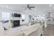 Bright, open living room with fireplace, hardwood floors, and kitchen view at 2292 Skyler Dr, Mount Pleasant, SC 29466