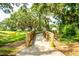 Scenic wooden bridge surrounded by lush greenery, offering a tranquil path through a wooded area at 2292 Skyler Dr, Mount Pleasant, SC 29466