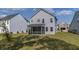 The backyard view includes a screened porch, a lush lawn, and the home's exterior at 234 Daniels Creek Cir, Goose Creek, SC 29445