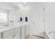 Neutral bathroom showcasing double sink vanity, framed mirror, tub and separate toilet areas at 234 Daniels Creek Cir, Goose Creek, SC 29445