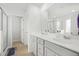 Bright bathroom featuring double sink vanity, framed mirror, and separate shower and toilet areas at 234 Daniels Creek Cir, Goose Creek, SC 29445