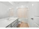 Modern bathroom showcasing a single sink vanity, framed mirror, tub and separate toilet areas at 234 Daniels Creek Cir, Goose Creek, SC 29445