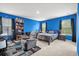 Bedroom with blue walls, comfortable seating, and ample closet space at 234 Daniels Creek Cir, Goose Creek, SC 29445