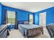 Bright bedroom features a cozy bed, large windows, and ample natural light at 234 Daniels Creek Cir, Goose Creek, SC 29445
