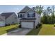 Charming two-story home with a well-maintained lawn and a convenient two-car garage at 234 Daniels Creek Cir, Goose Creek, SC 29445