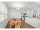 Eat-in kitchen includes a wooden dining table, modern stainless steel appliances, and granite countertops at 234 Daniels Creek Cir, Goose Creek, SC 29445