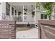 This rear covered porch features a ceiling fan and outdoor dining area at 24 Hanover St, Charleston, SC 29403