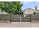 A wooden gate offers access to the backyard and patio area at 24 Hanover St, Charleston, SC 29403