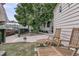 Cozy backyard with lounge chairs, grassy area and a view of the surrounding neighborhood at 24 Hanover St, Charleston, SC 29403