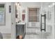 Bright bathroom with marble vanity and black fixtures and a glass shower with window at 24 Hanover St, Charleston, SC 29403