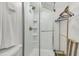 Modern bathroom featuring a glass shower door and built-in shelving at 24 Hanover St, Charleston, SC 29403