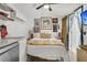 Bright bedroom with a kitchen area, white walls and decorative artwork at 24 Hanover St, Charleston, SC 29403