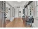 Inviting entryway with hardwood floors, natural light, and a vintage table at 24 Hanover St, Charleston, SC 29403