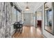 Welcoming foyer with hardwood floors, a dining nook, and abundant natural light at 24 Hanover St, Charleston, SC 29403