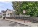 Cozy home with a fenced front yard, and mature landscaping at 24 Hanover St, Charleston, SC 29403
