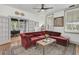 Cozy living room with large windows, a comfortable sofa, and neutral walls at 24 Hanover St, Charleston, SC 29403