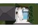 An aerial view shows the pool and patio area with outdoor seating and umbrella at 2405 Louisville St, Charleston, SC 29492