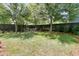 Spacious backyard featuring a well-manicured lawn and a charming outdoor dining area with comfortable seating at 2405 Louisville St, Charleston, SC 29492