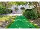 Beautiful backyard with a putting green and outdoor lounge area for entertainment and relaxation at 2405 Louisville St, Charleston, SC 29492