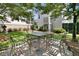 Charming backyard offers a comfortable outdoor seating area perfect for relaxing, with landscaping at 2405 Louisville St, Charleston, SC 29492