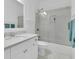 Bathroom featuring vanity with marble countertop, bathtub with glass doors and soft white rug at 2405 Louisville St, Charleston, SC 29492