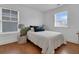 Cozy bedroom with natural light, hardwood floors, and stylish decor, creating a peaceful and relaxing retreat at 2405 Louisville St, Charleston, SC 29492