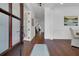 Grand foyer with a hardwood floor, view into other rooms and natural light from the front door at 2405 Louisville St, Charleston, SC 29492