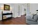Inviting hallway with hardwood floors, elegant trim, and stylish decor leading to other rooms at 2405 Louisville St, Charleston, SC 29492