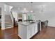 Bright kitchen with a center island, modern appliances, and hardwood floors open to the living area at 2405 Louisville St, Charleston, SC 29492