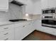 Close-up of a modern kitchen with marble countertops, stainless steel appliances, and ample storage space at 2405 Louisville St, Charleston, SC 29492