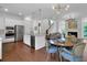Open-concept kitchen features stainless steel appliances, custom cabinetry, and a dining area at 2405 Louisville St, Charleston, SC 29492