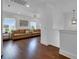 This bright living room boasts hardwood floors and natural light from the large windows, great for Gathering gatherings at 2405 Louisville St, Charleston, SC 29492