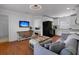 Cozy living room featuring a TV, an open kitchen, and a comfortable sofa, creating a welcoming atmosphere at 2405 Louisville St, Charleston, SC 29492